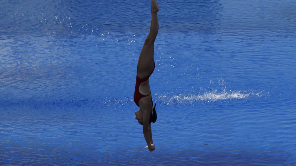 Eine Wasserspringerin taucht bei der JEM 2024 in Rijeka ins Wasser